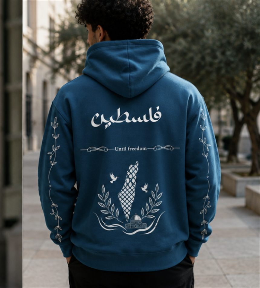 Back of the Until Freedom hoodie: Palestine in keffiyeh weave framed by olive branches and doves, with Falasteen in Arabic above